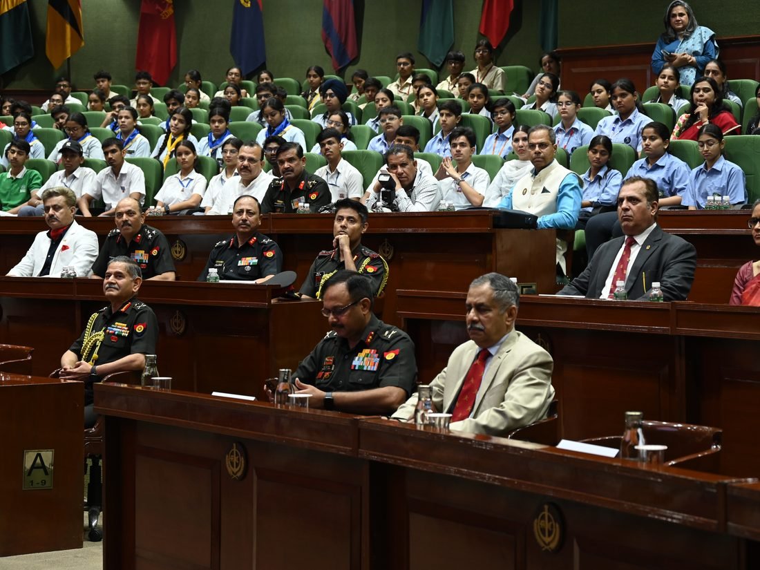 Serving officers seated with the audience