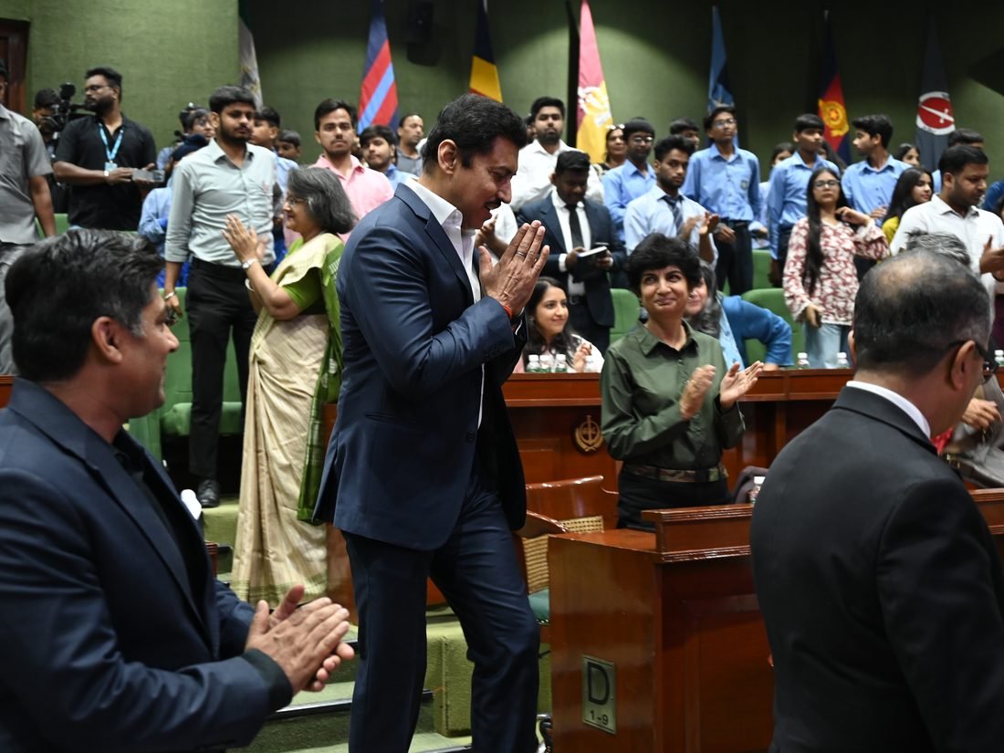 Students and dignitaries meeting after a session